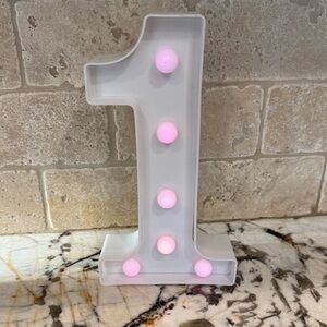 Light-Up Number 1 Marquee Sign - changing colored lights.